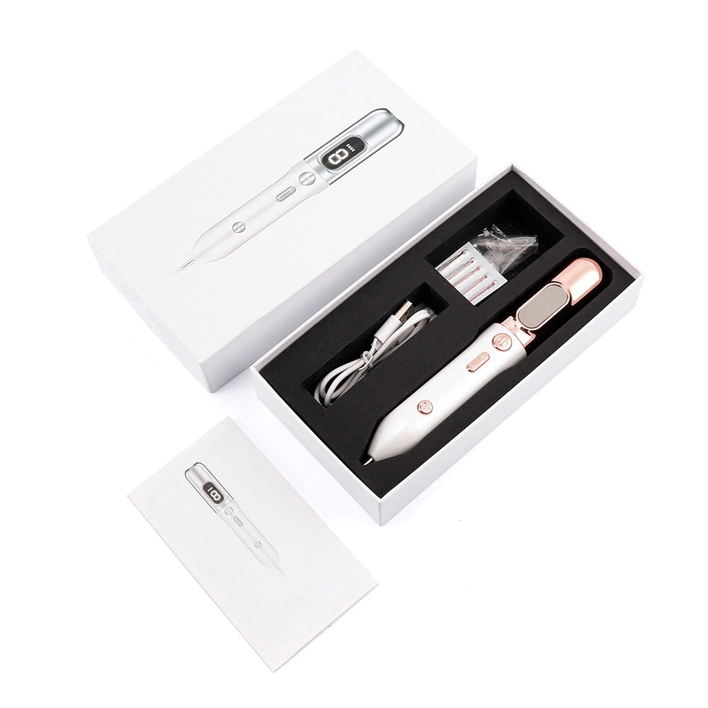 Fibroblast Plasma Pen unboxed with the disposable needles, charging cable and manual guide